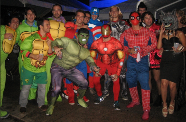 several costumed revelers dress as comic book and TV heroes